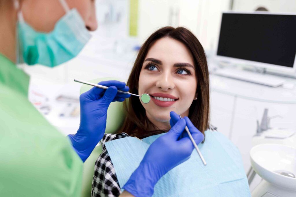 Patient smiling during routine dental examination