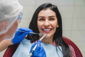 Patient smiling during a dental implant consultation